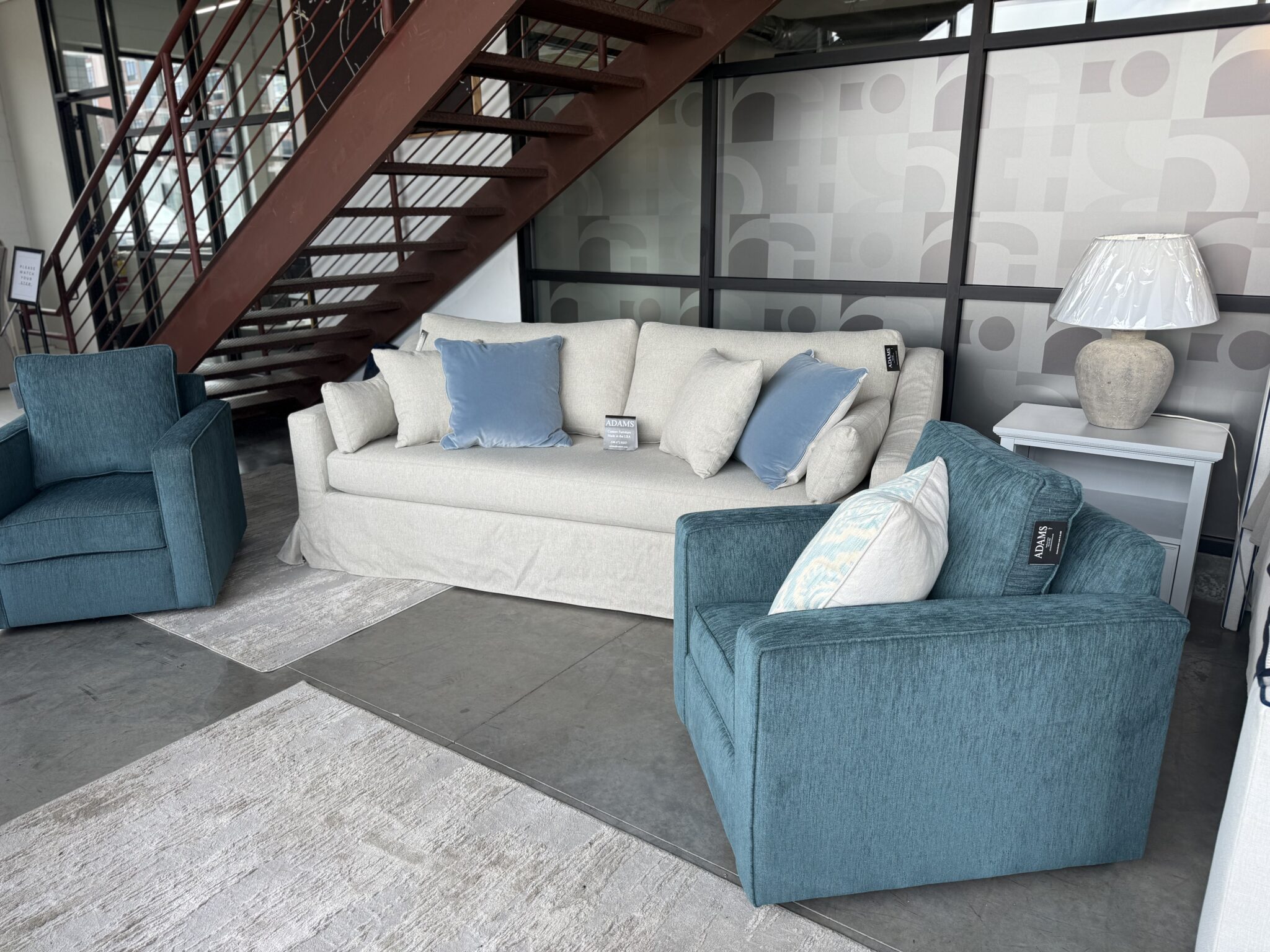 Showroom seating with staircase backdrop