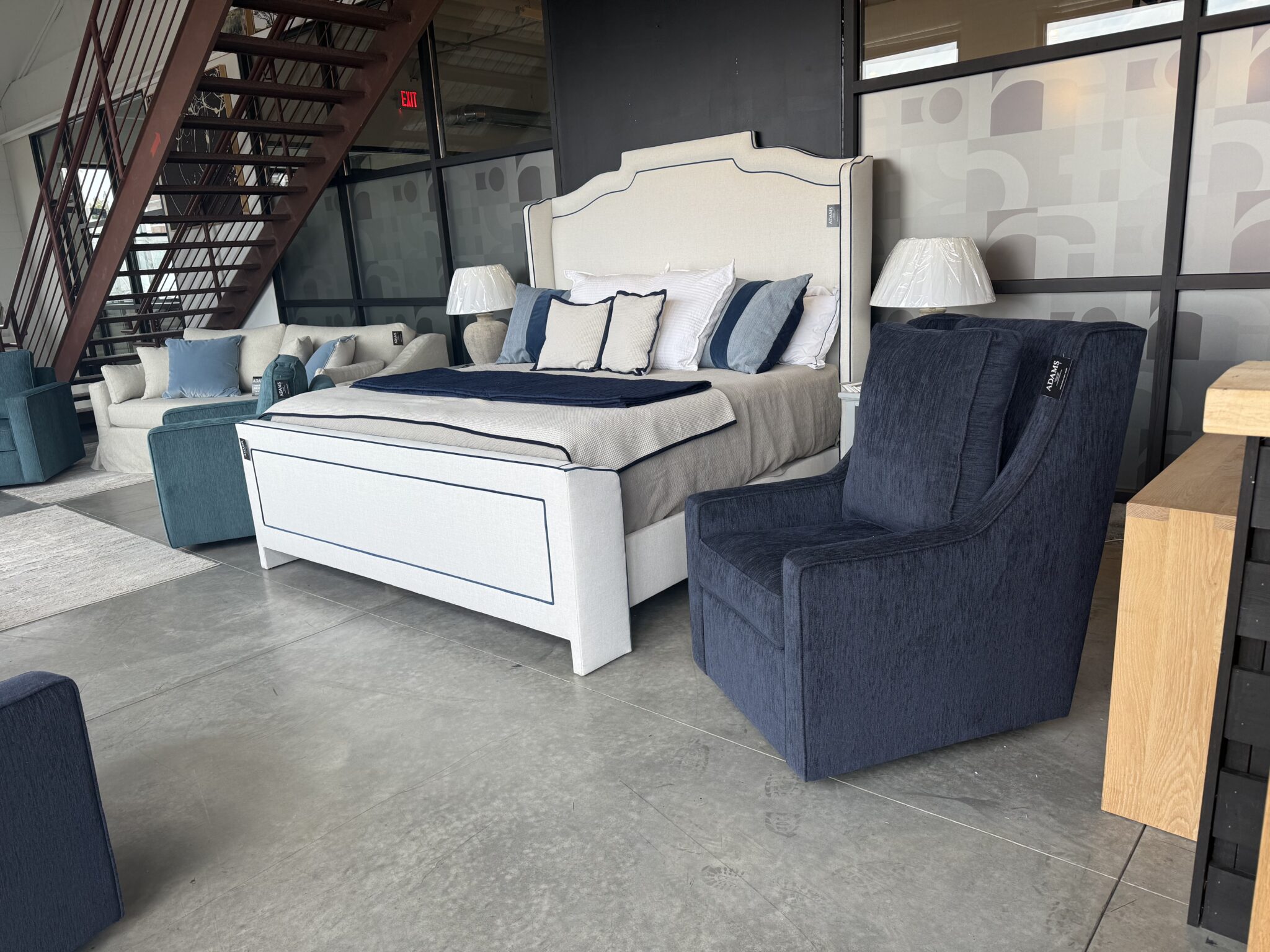 Custom upholstered bed staging with staircase